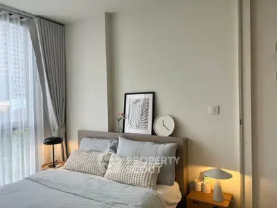 Cozy bedroom with modern decor and natural light in urban apartment