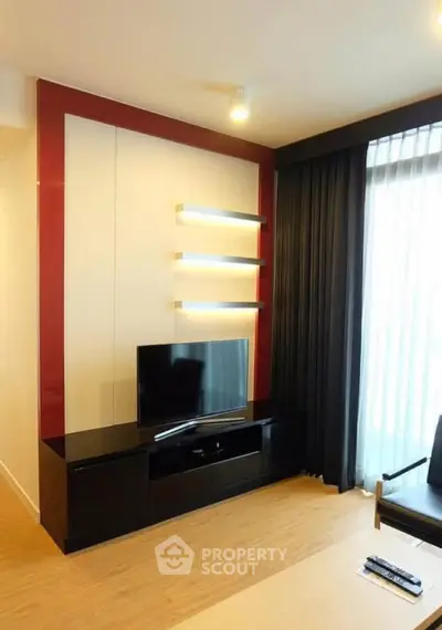 Modern living room with sleek TV unit and stylish lighting