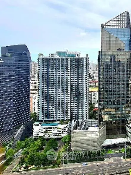 Stunning cityscape view showcasing modern high-rise buildings with sleek architecture and lush greenery.