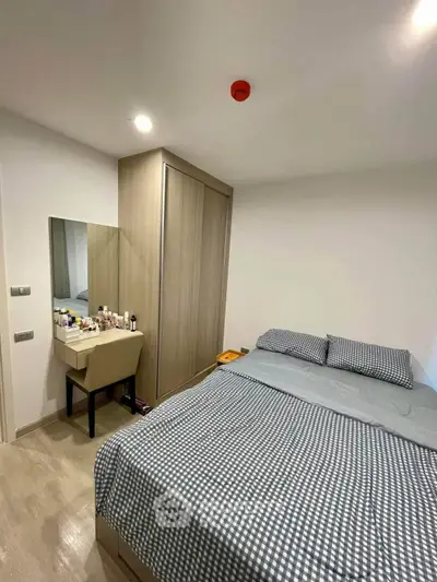 Cozy bedroom with modern decor and ample storage space