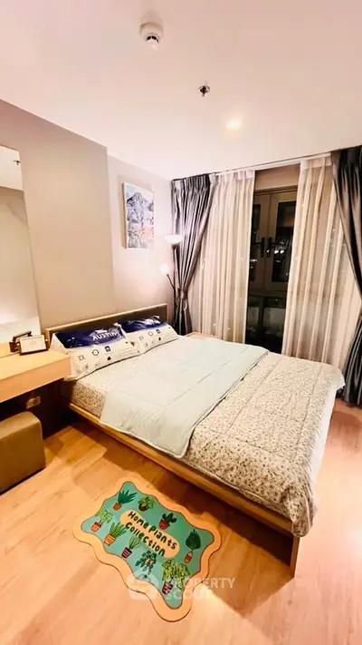 Cozy bedroom with modern decor and large window for natural light