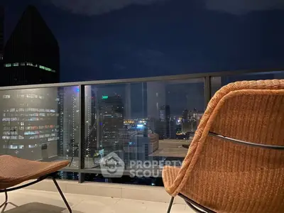 Stunning cityscape view from a modern balcony at night, perfect for urban living.