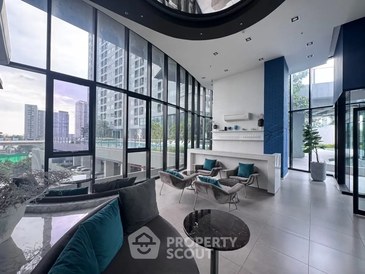 Luxurious modern living room with floor-to-ceiling windows and elegant decor