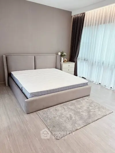 Modern bedroom with stylish bed and elegant curtains