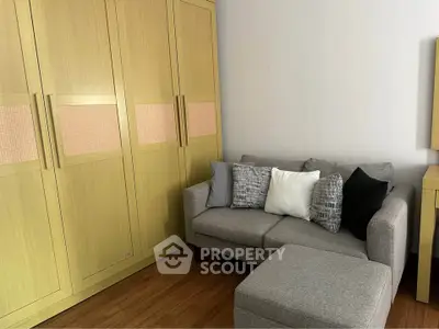 Cozy living room with modern sofa and spacious wardrobe