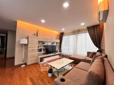 Spacious modern living room with elegant lighting and cozy seating area