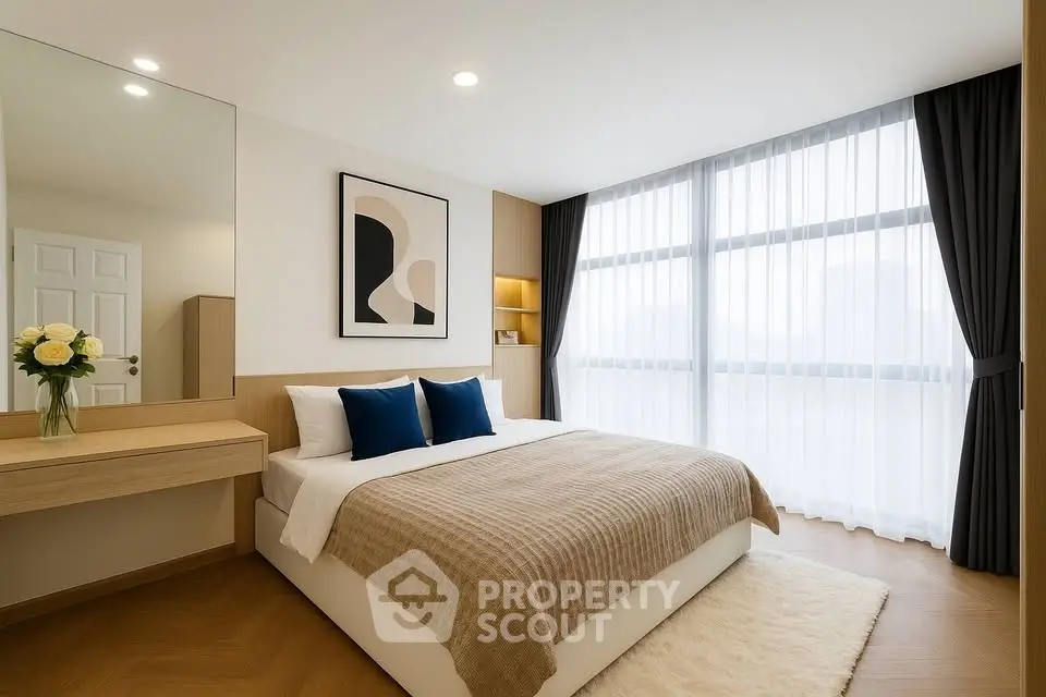 Modern bedroom with large window, stylish decor, and cozy ambiance.