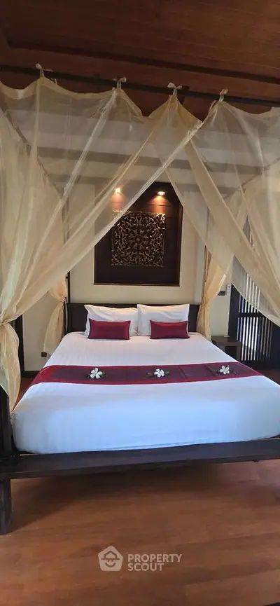 Luxurious bedroom with elegant canopy bed and stylish decor