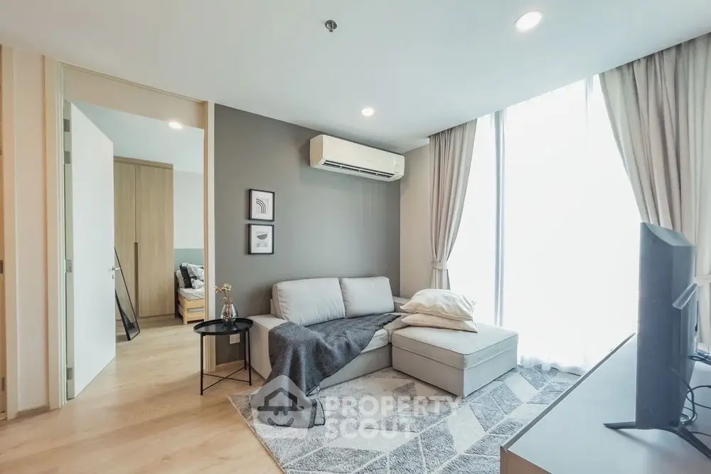 Modern living room with stylish decor and ample natural light