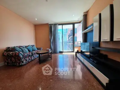 Spacious living room with modern decor and city view balcony