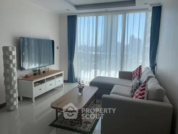 Modern living room with large windows and stylish furniture