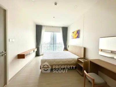 Spacious modern bedroom with city view and minimalist decor