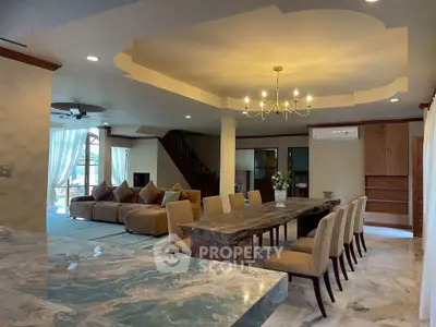 Spacious living and dining area with elegant decor and natural light