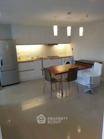 Modern kitchen with sleek design, featuring open layout and contemporary appliances.