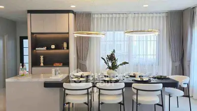 Elegant dining area with modern decor and stylish lighting in a contemporary home.