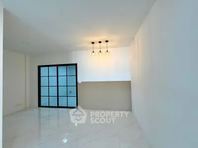 Modern minimalist interior with elegant lighting and sleek tiled flooring