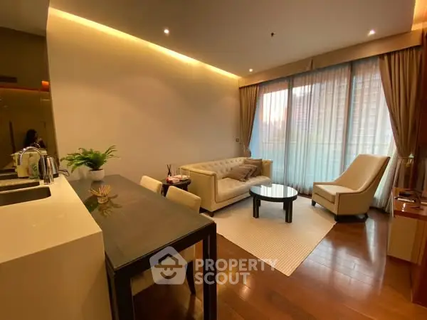 Elegant living room with modern furniture and large windows for natural light.
