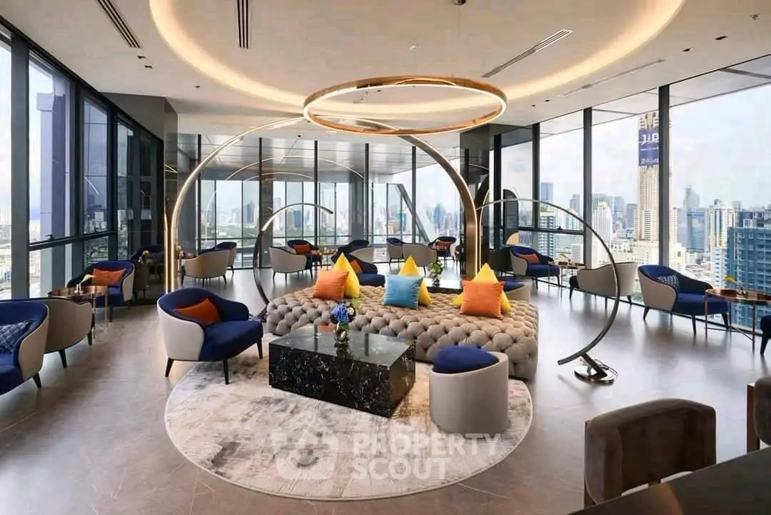 Luxurious modern living room with panoramic city views and elegant circular lighting.