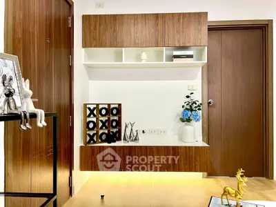 Modern living room with stylish wooden cabinetry and decorative accents