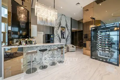 Luxurious modern living room with marble floors and elegant chandelier