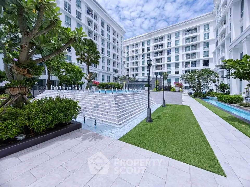 Luxurious apartment complex with elegant courtyard and fountain