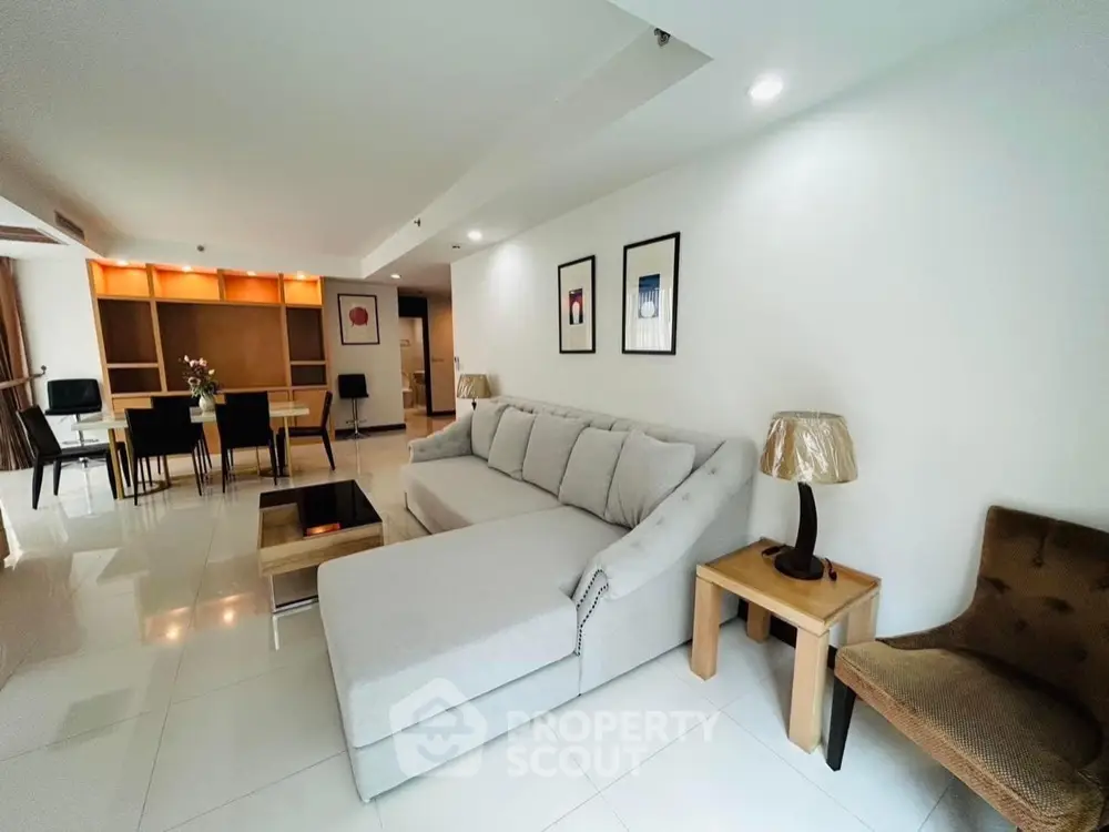 Spacious modern living room with elegant decor and open dining area