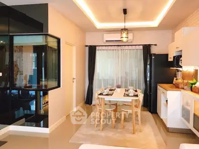 Modern dining area with stylish kitchen and elegant lighting