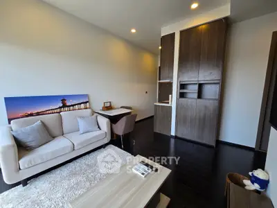 Modern living room with cozy sofa and stylish decor in a contemporary apartment.