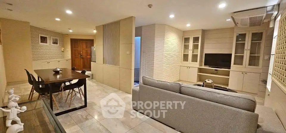Spacious modern living room with elegant dining area and stylish decor