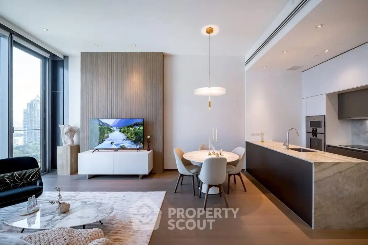 Luxurious modern living room with open kitchen and stunning city view