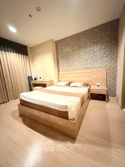 Modern bedroom with stylish decor and wooden flooring