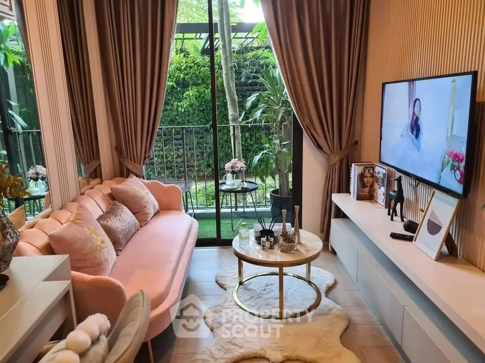 Chic living room with plush pink sofa and garden view, perfect for relaxation.