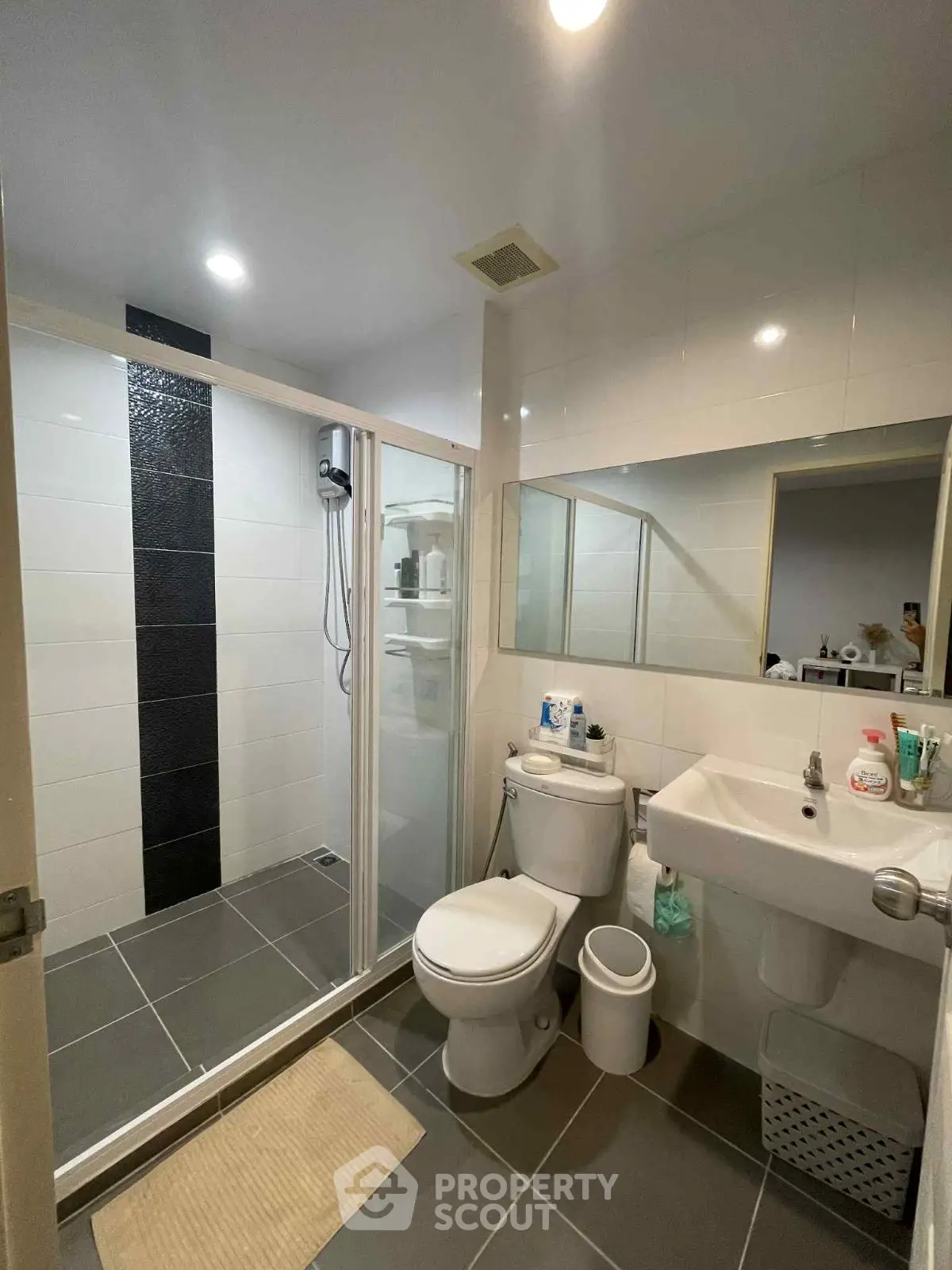 Modern bathroom with glass shower and sleek fixtures