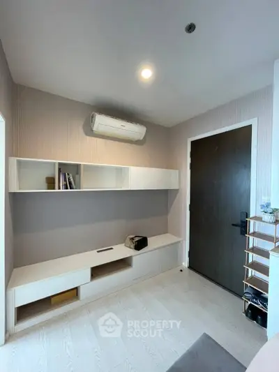 Modern study room with sleek storage and air conditioning, perfect for productivity and comfort.