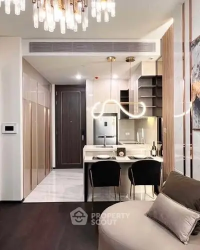 Modern kitchen with sleek design, open layout, and stylish lighting in a contemporary apartment.