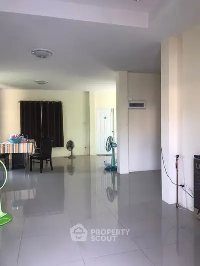 Spacious interior with tiled flooring and modern dining area