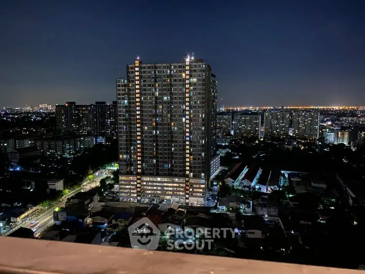 Stunning night view of illuminated high-rise building in vibrant cityscape.