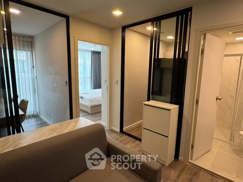 Modern apartment interior with cozy living room and bedroom view