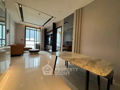 Luxurious modern living room with elegant marble table and city view balcony.