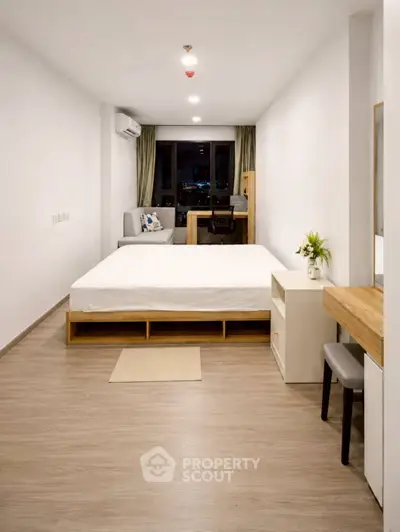 Modern studio apartment with minimalist design and city view
