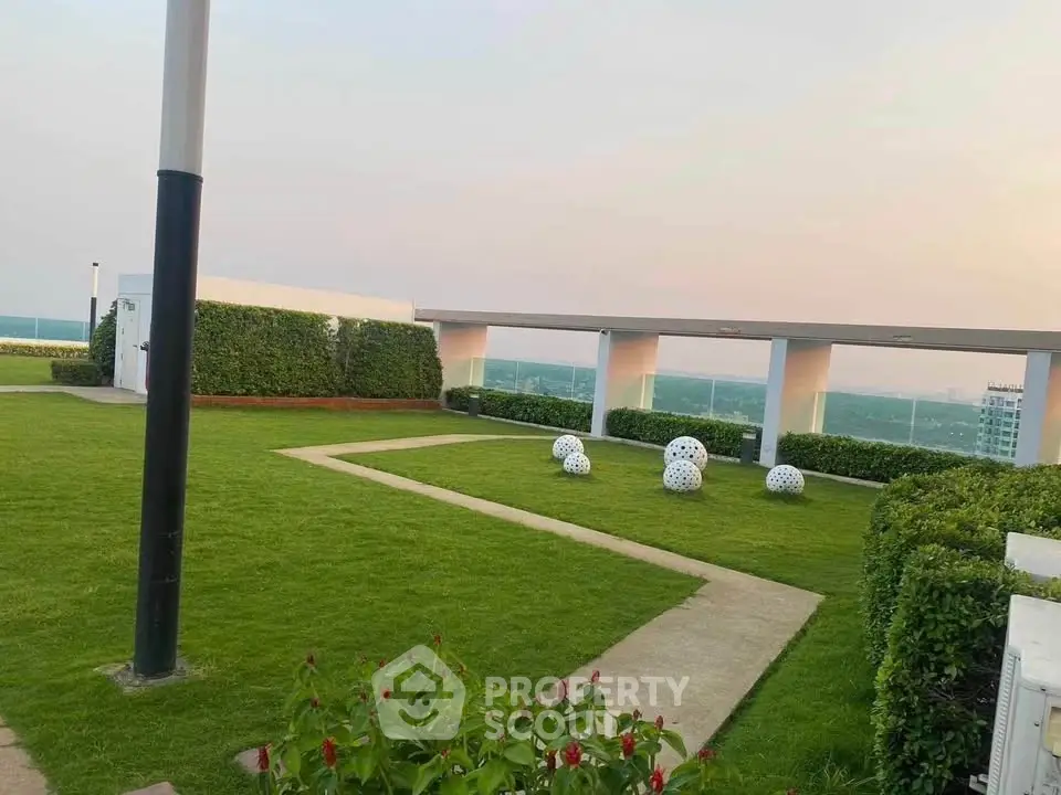 Stunning rooftop garden with lush greenery and panoramic city views.