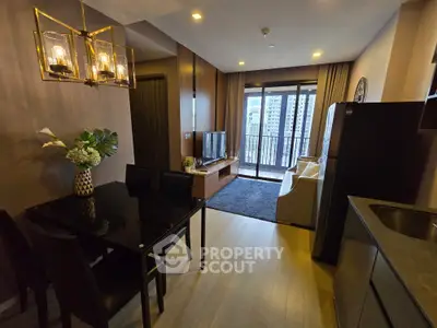 Modern living room with elegant dining area and balcony view in a stylish apartment.