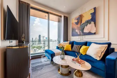 Luxurious living room with modern decor and stunning city view from large windows.