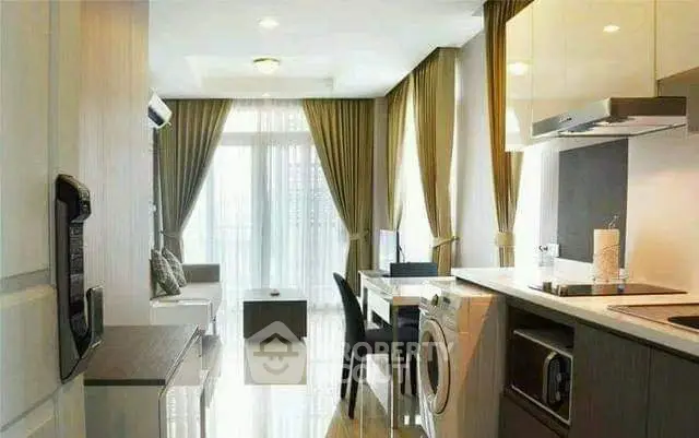 Modern apartment interior with open kitchen and living area, featuring sleek design and natural light.