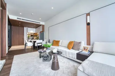 Luxurious modern living room with elegant decor and open kitchen layout