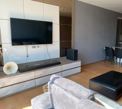 Modern living room with sleek TV setup and stylish furniture