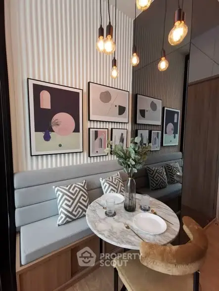 Chic dining nook with modern art and cozy seating in stylish apartment