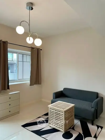 Cozy living room with modern lighting and minimalist furniture