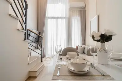 Elegant modern living room with dining area and stylish decor