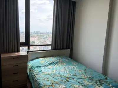 Modern bedroom with stunning city view and elegant decor